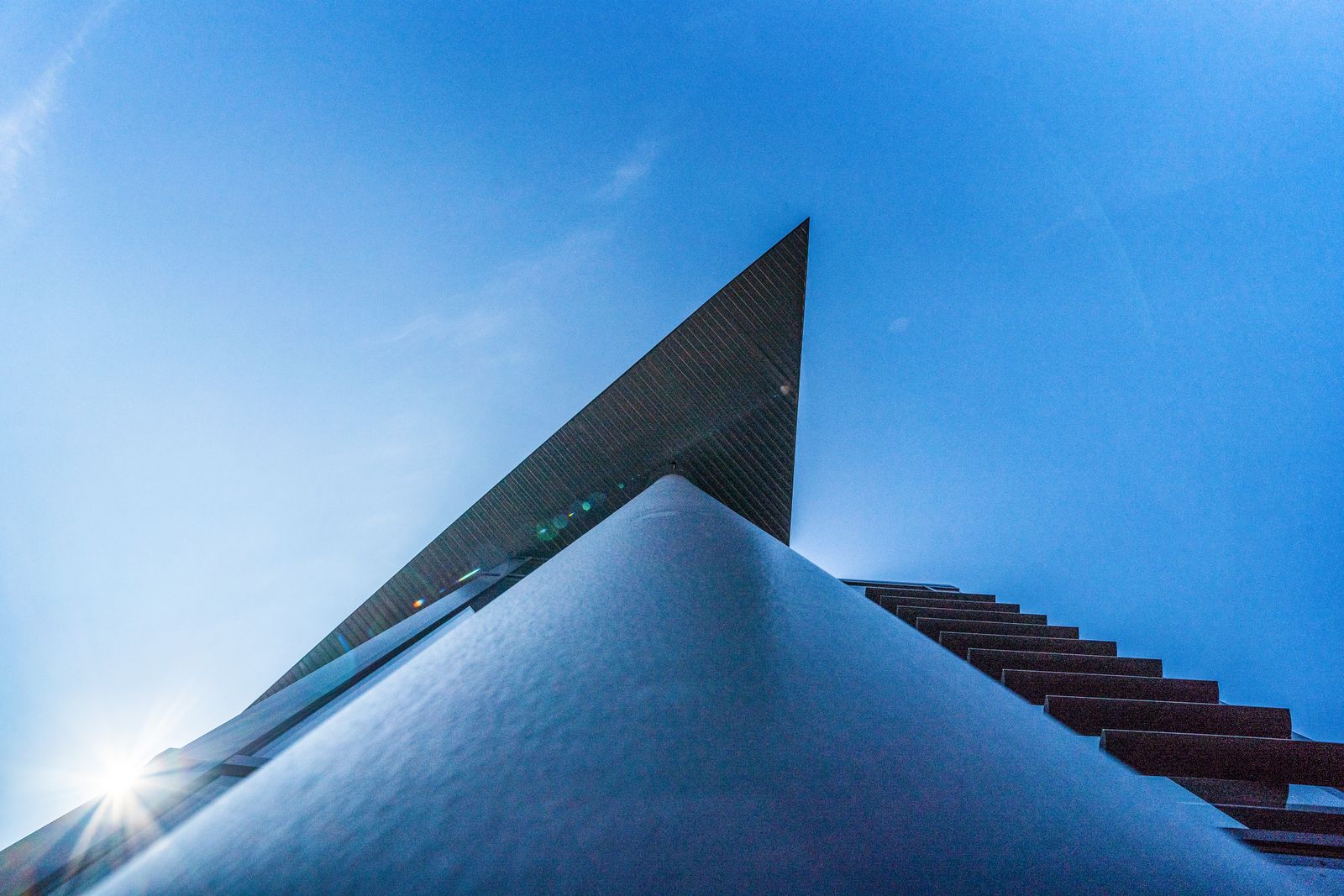 Pointed roof edge against a blue sky