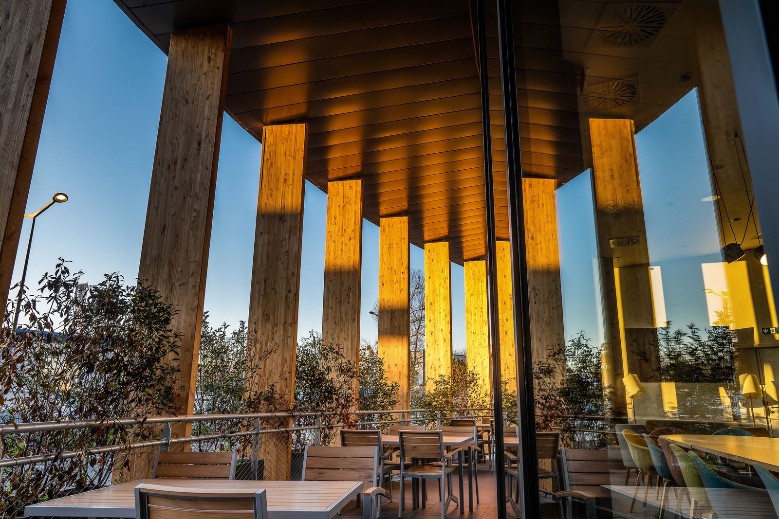 Timber columns of a restaurant at dusk