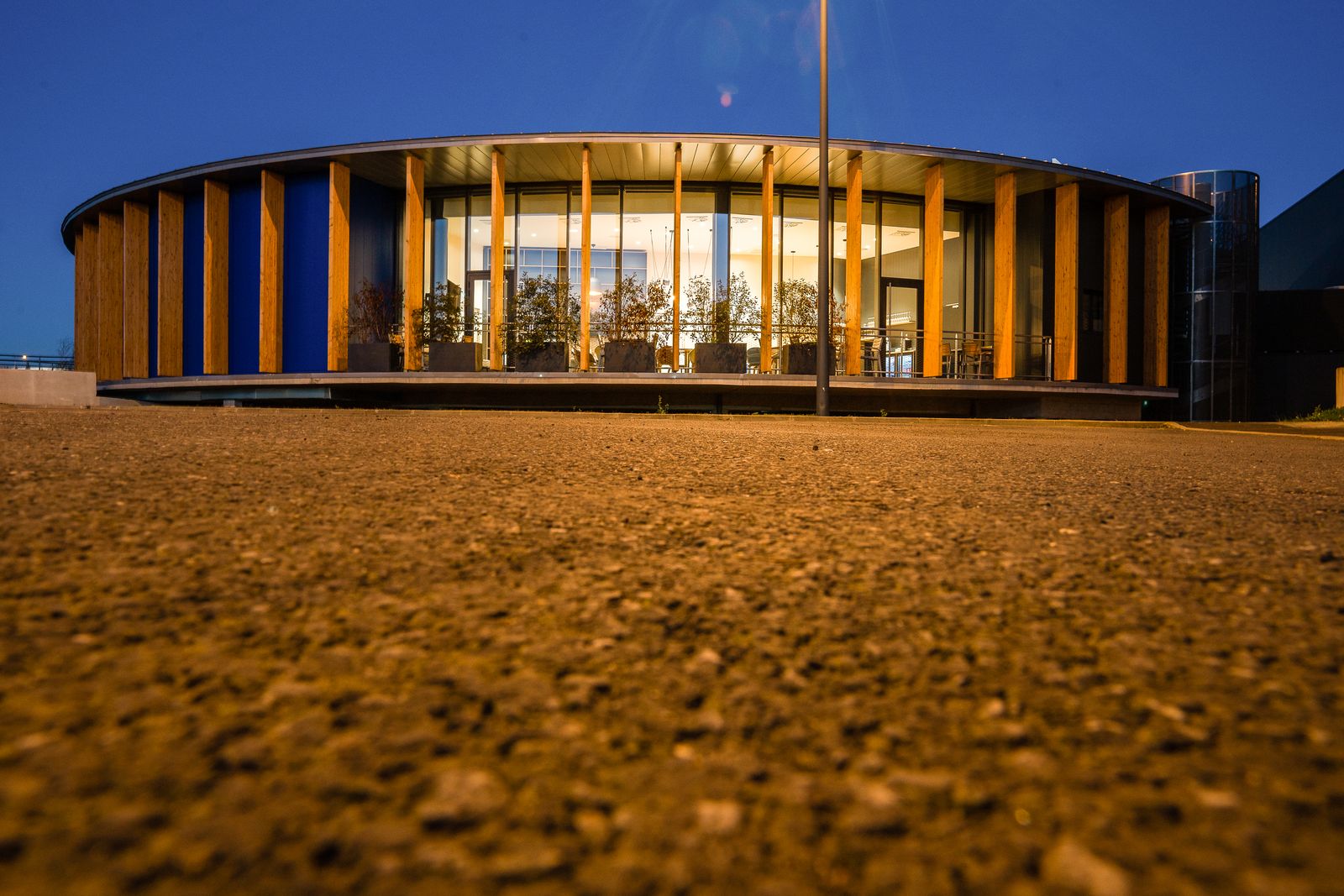 Circular restaurant lit up at night