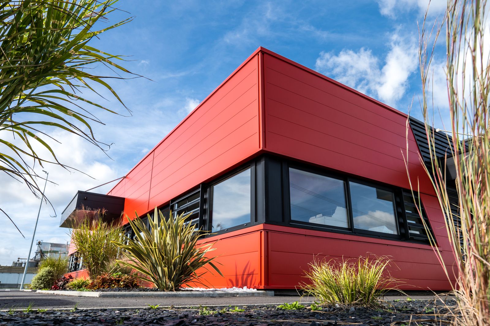 Red façade and black cladding of a commercial building