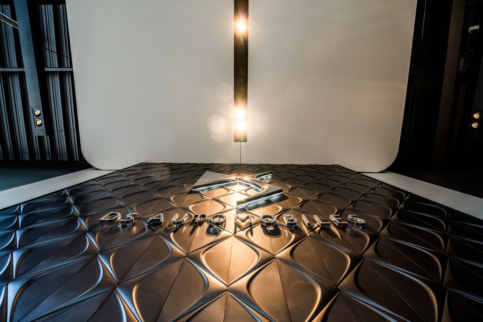Textured showroom floor under a top light