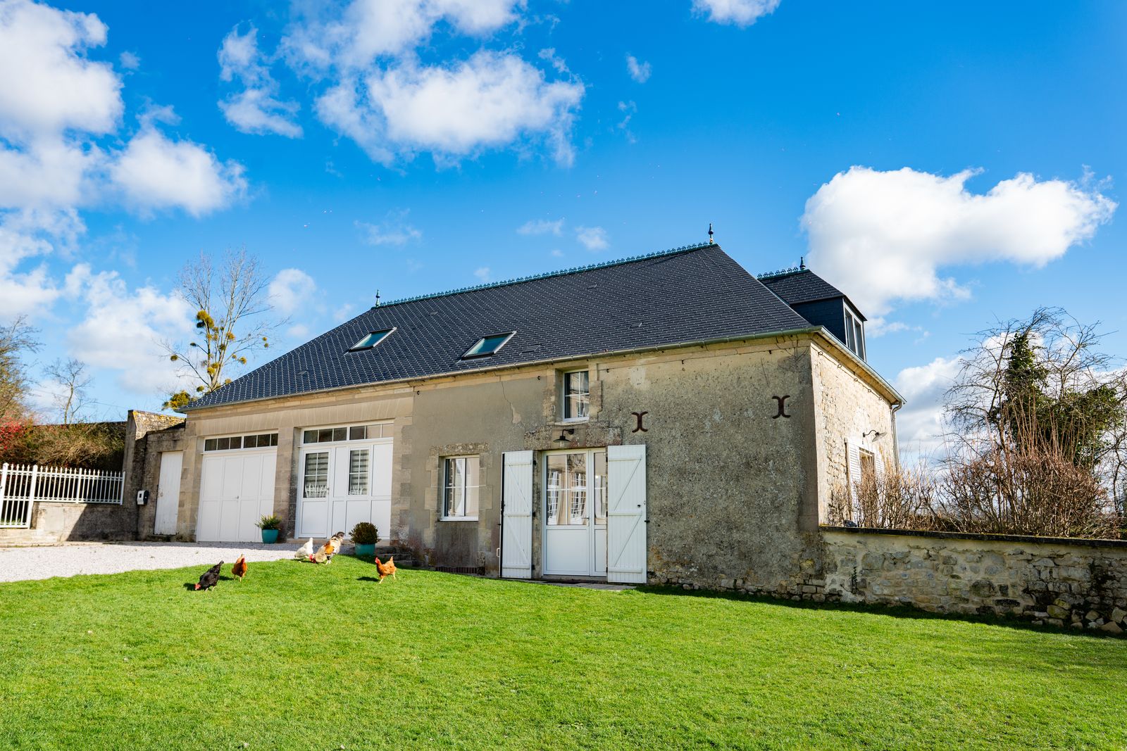 Stone gîte house on its lawn