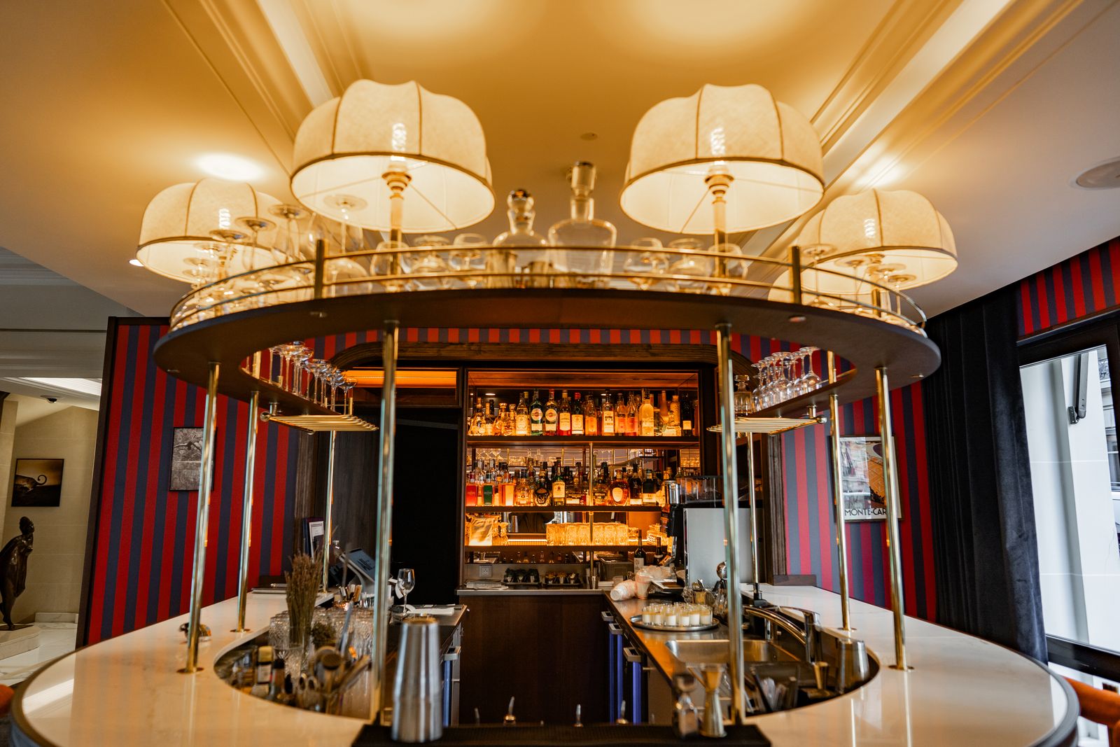 Circular hotel bar beneath its chandeliers