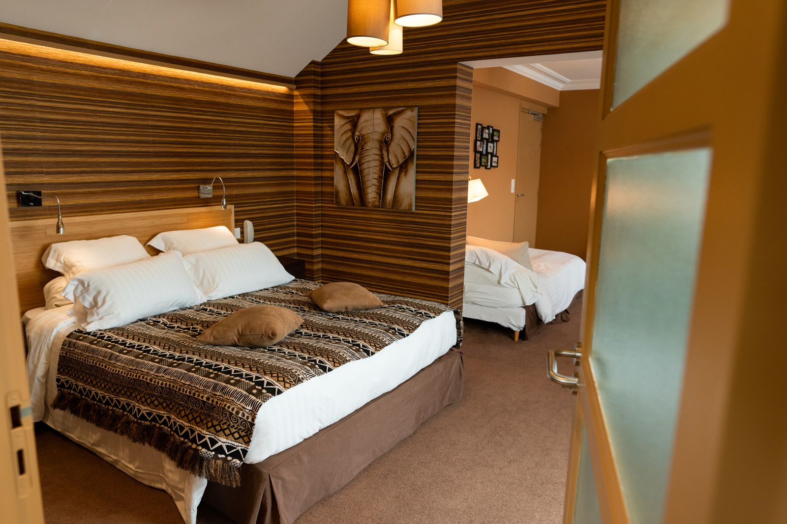 Hotel room with wood-clad walls