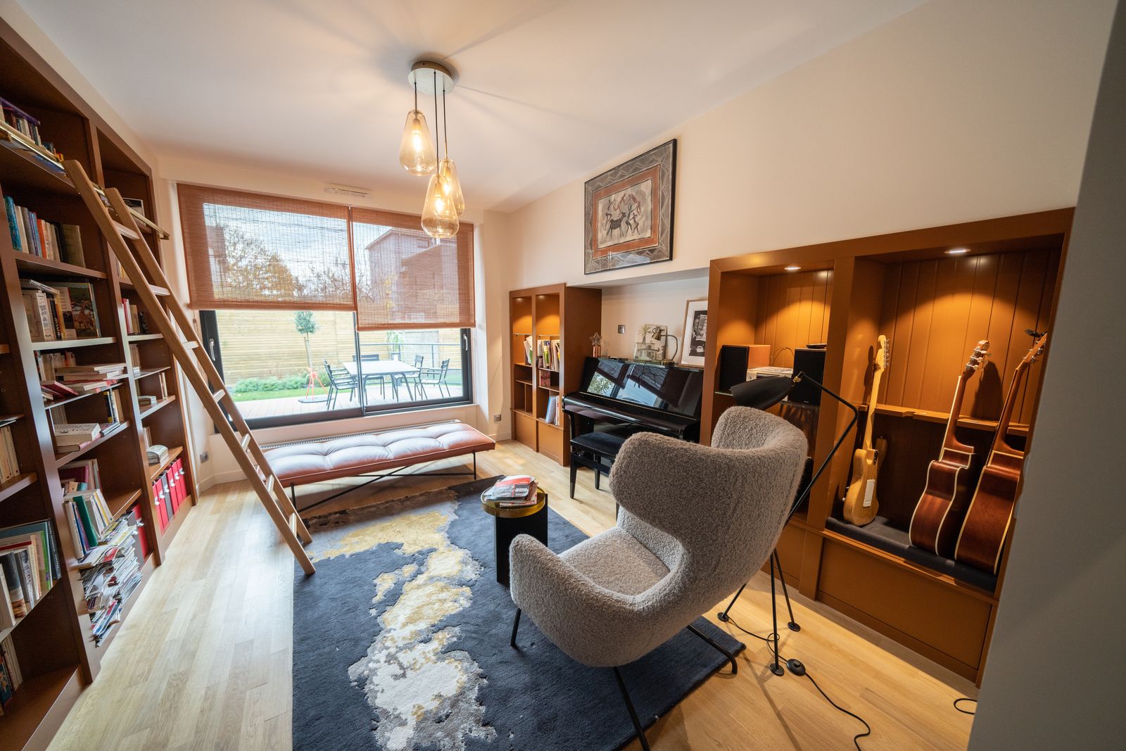 Bespoke library with ladder and piano
