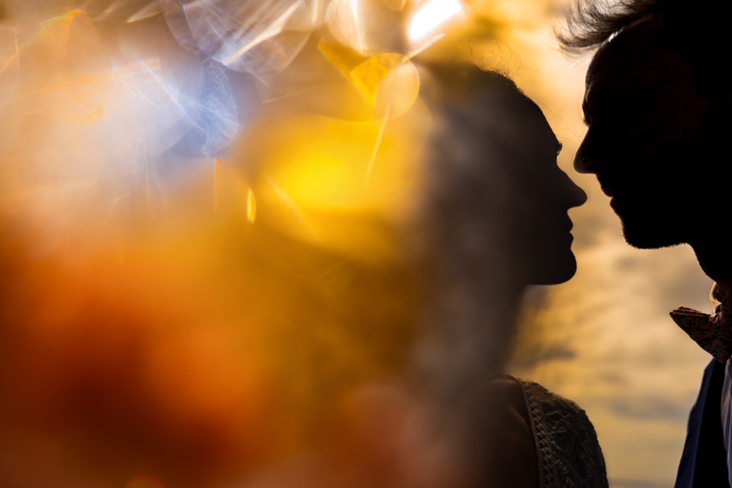 Couple silhouette at sunset in Normandy, France